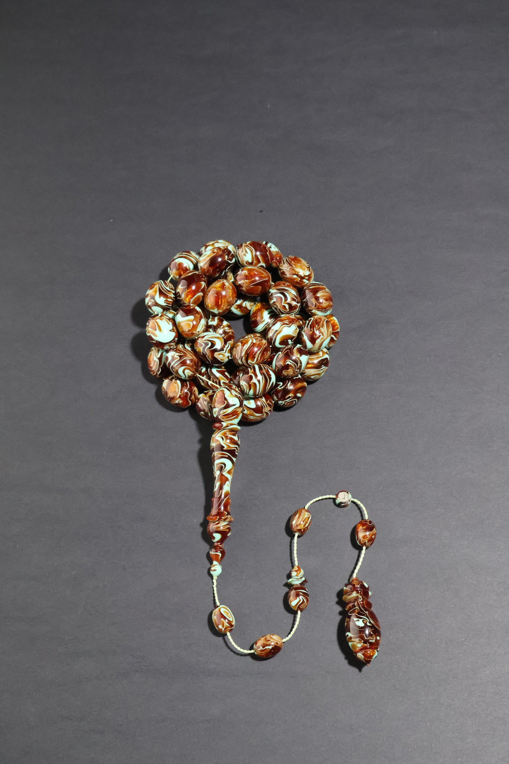 Beaded earring on a gray background