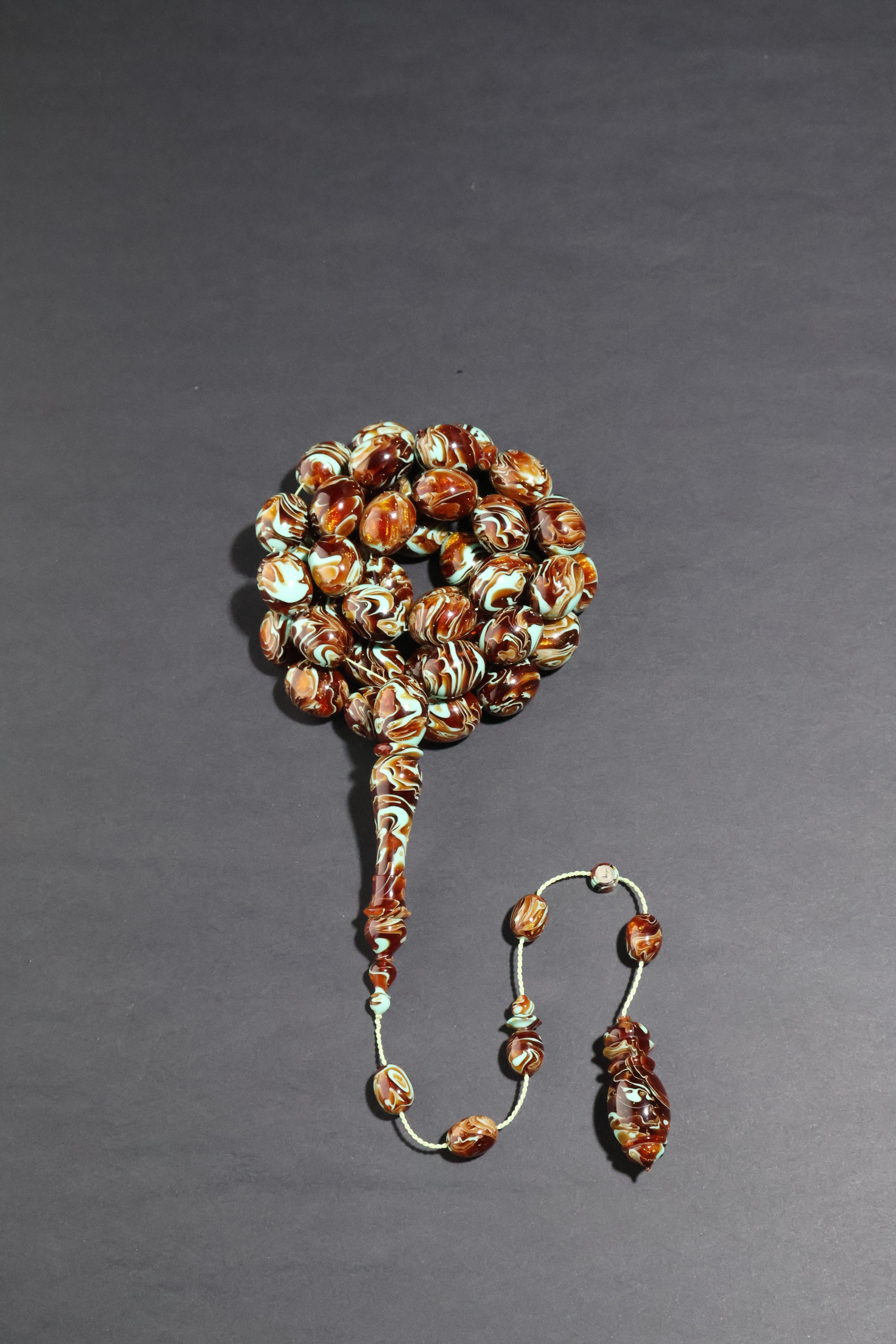 Beaded earring on a gray background